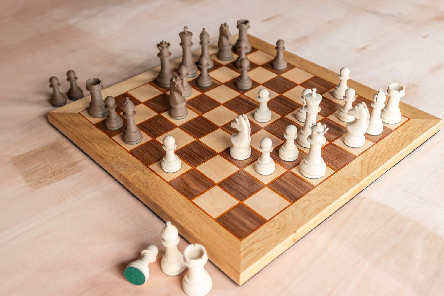 Solid hardwood chessboard set in walnut, maple and oak